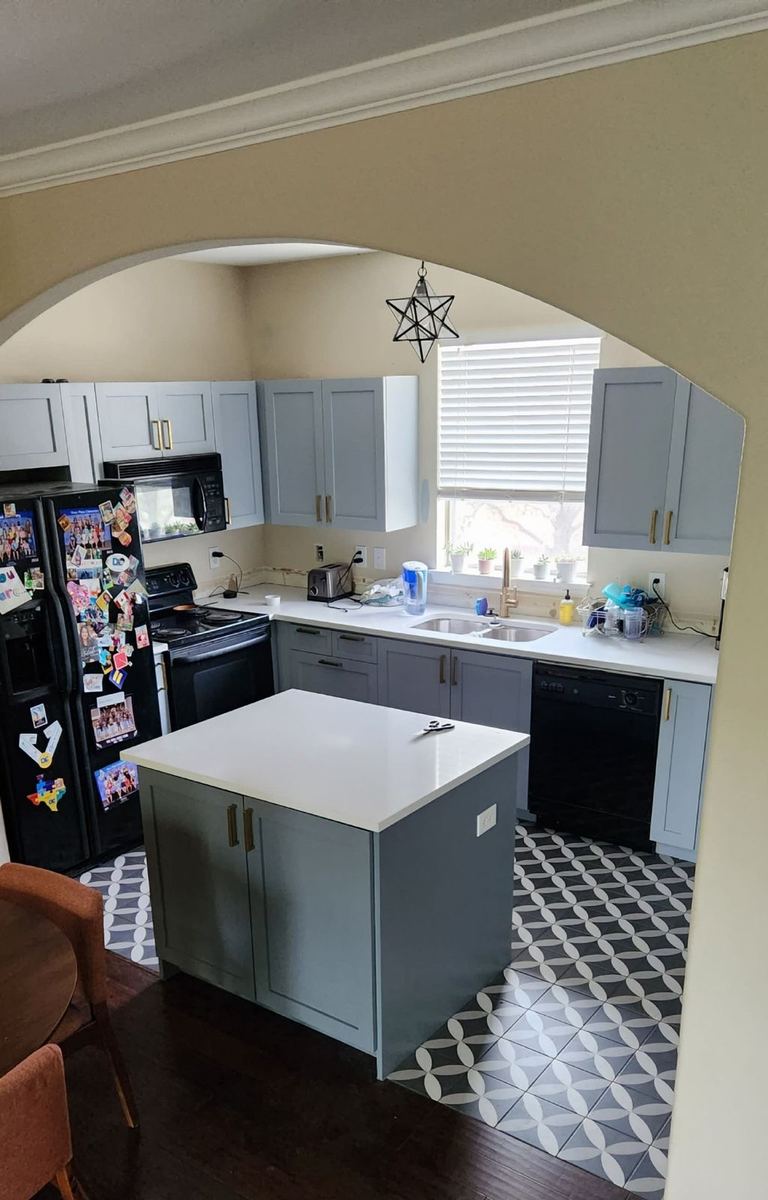 Custom kitchen with stained cabinetry and stone countertops