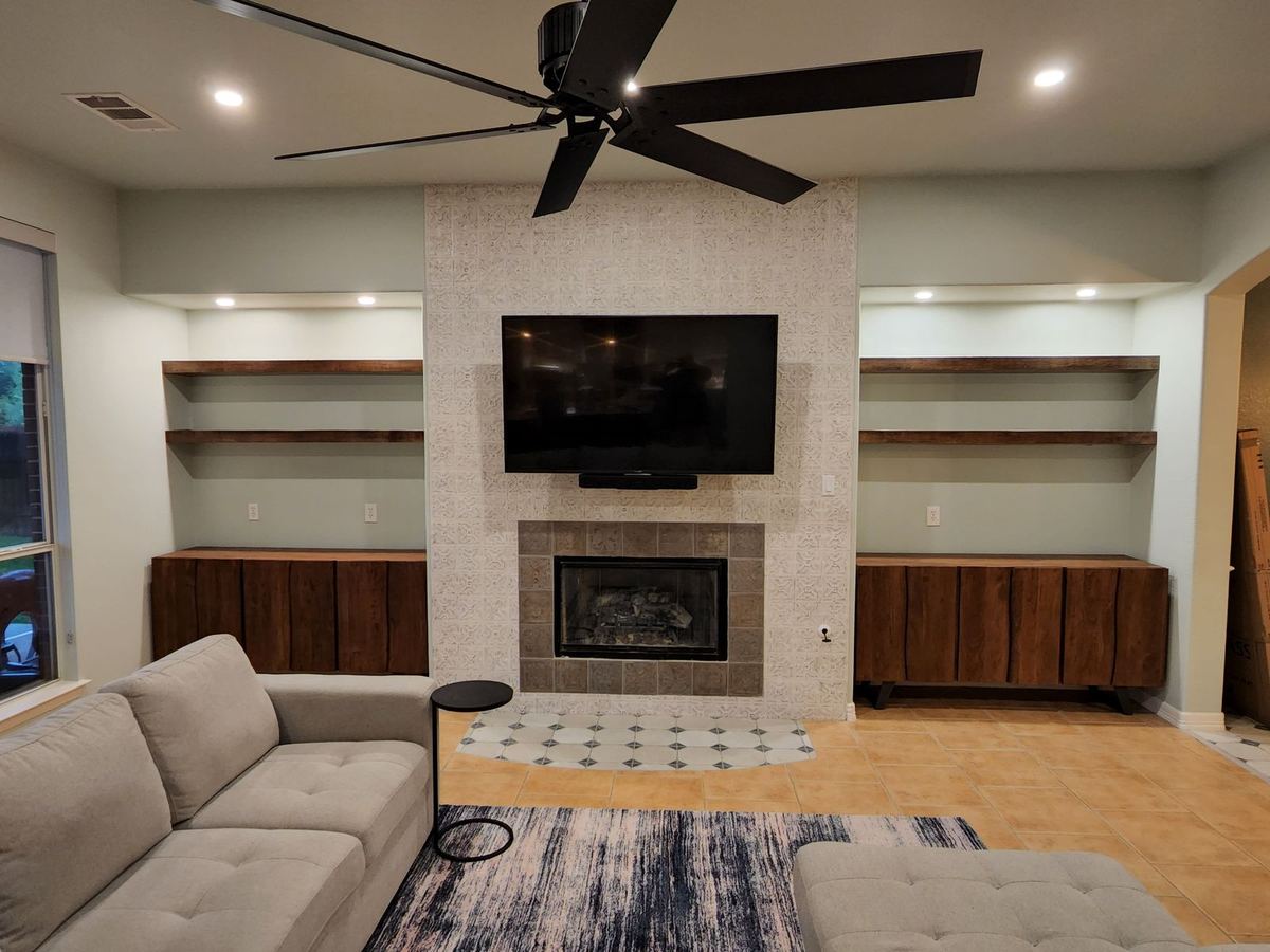 Bespoke media wall with integrated cabinetry and display niches
