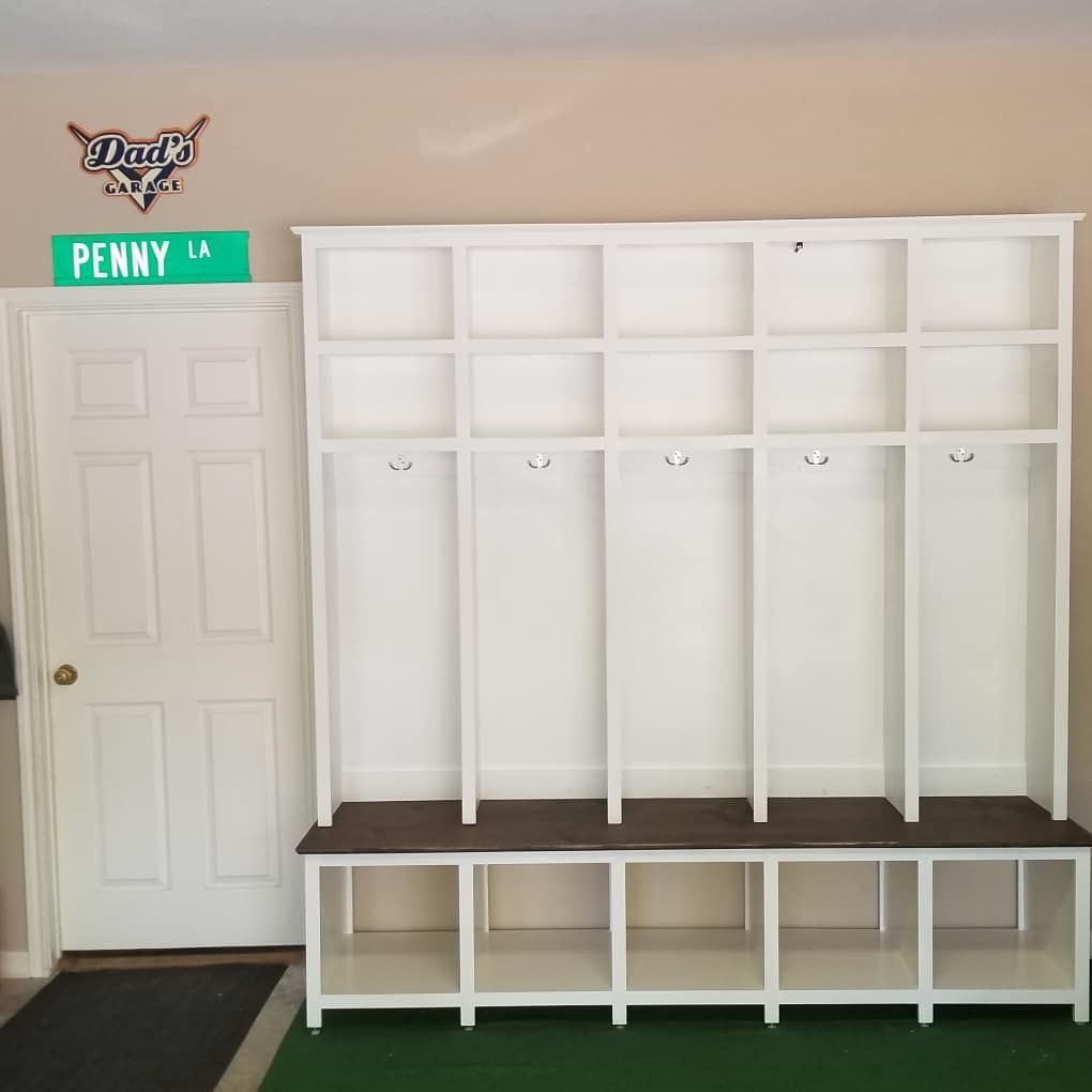 Tailored mudroom storage with hooks, drawers, and inset paneling