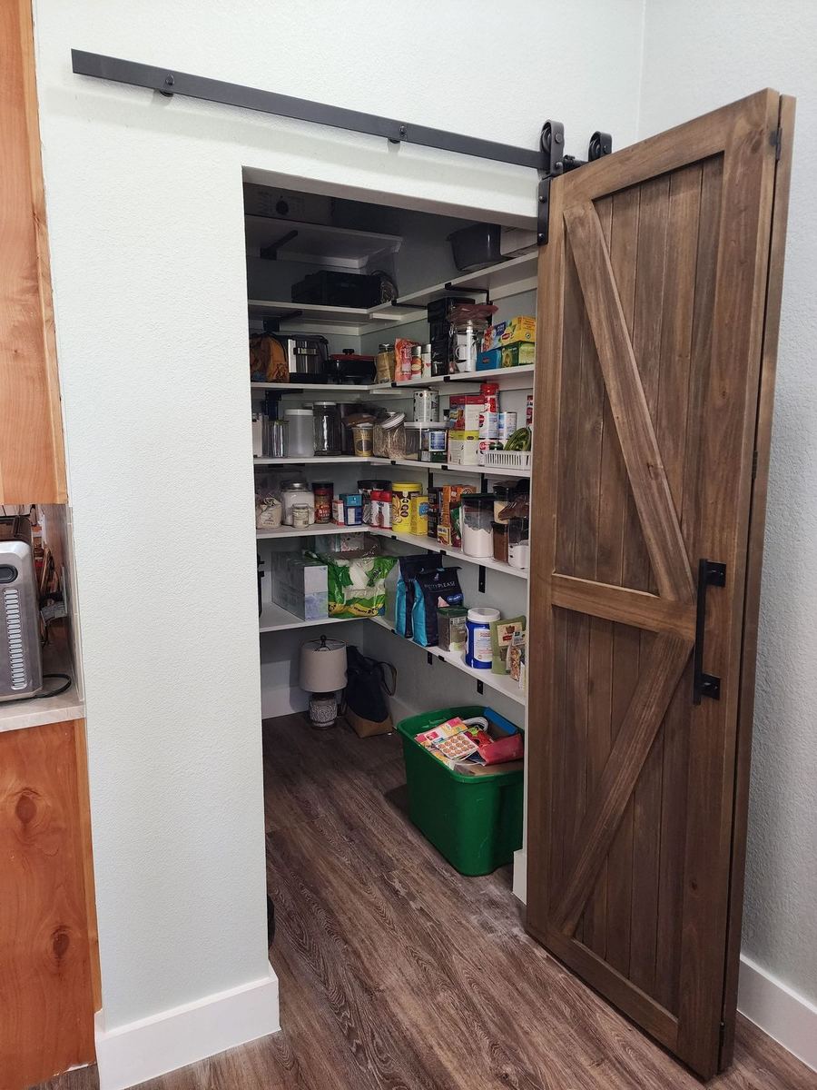 Bespoke barn-style sliding door with refined wood paneling